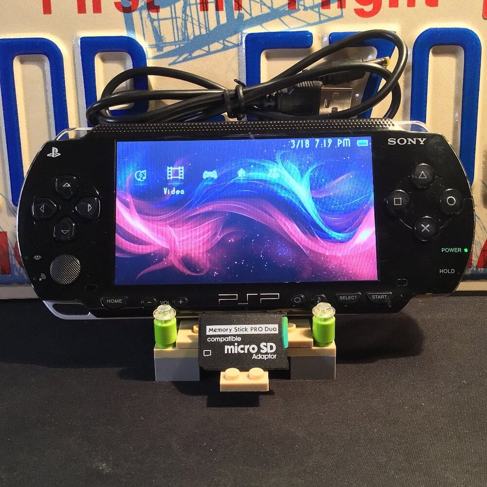 Sony PSP 1001 with Charger, Memory Stick, & Games
